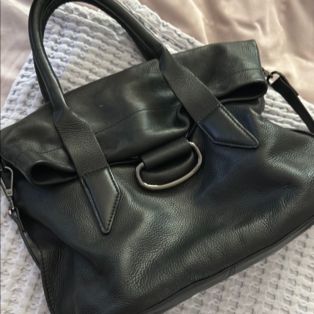 Kooba Elegant Black Leather Handbag with the long strap and magnetic closure